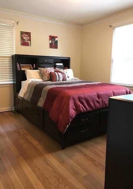 1677 Geraldine Drive Jacksonville, FL 32205 - Photo 32 of 52 a bedroom with a bed and wooden floor