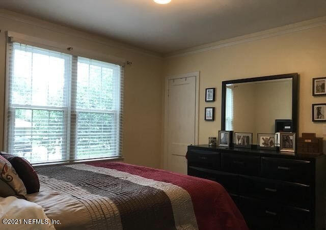 1677 Geraldine Drive Jacksonville, FL 32205 - Photo 34 of 52 a bedroom with a bed and a window