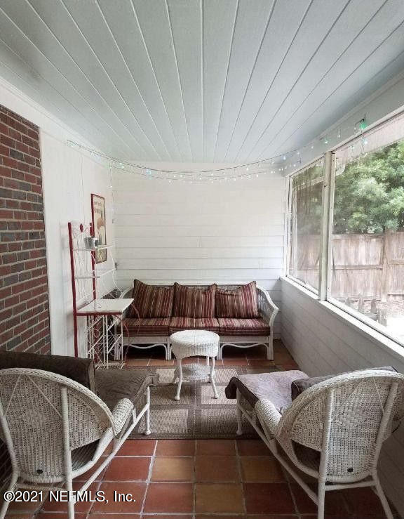 1677 Geraldine Drive Jacksonville, FL 32205 - Photo 38 of 52 a living room with furniture and a large window