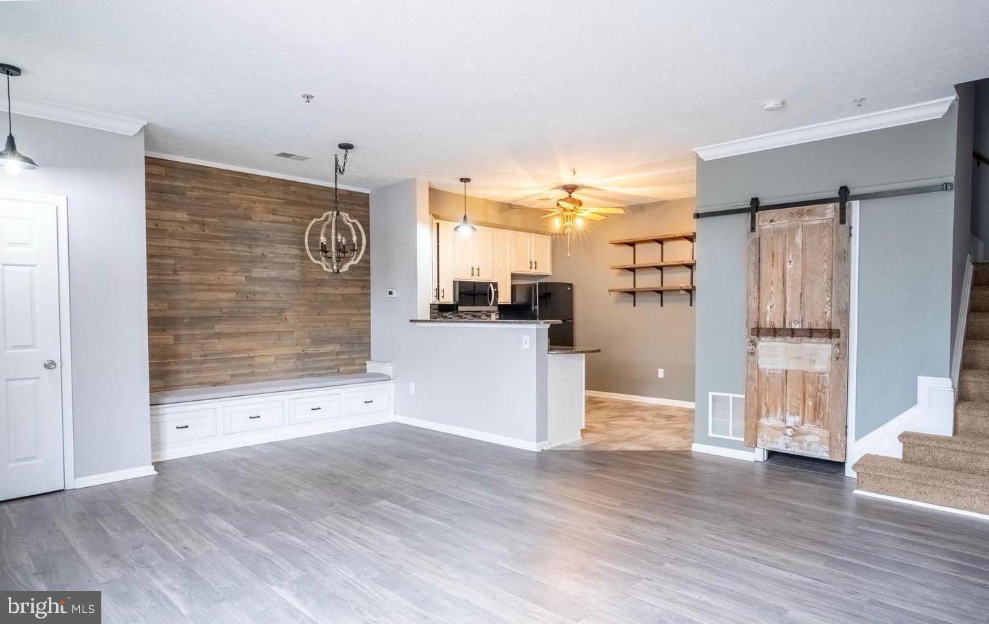 4910 Edgeware Terrace Frederick, MD 21703 - Photo 4 of 9 a view of a kitchen with wooden floor and a kitchen