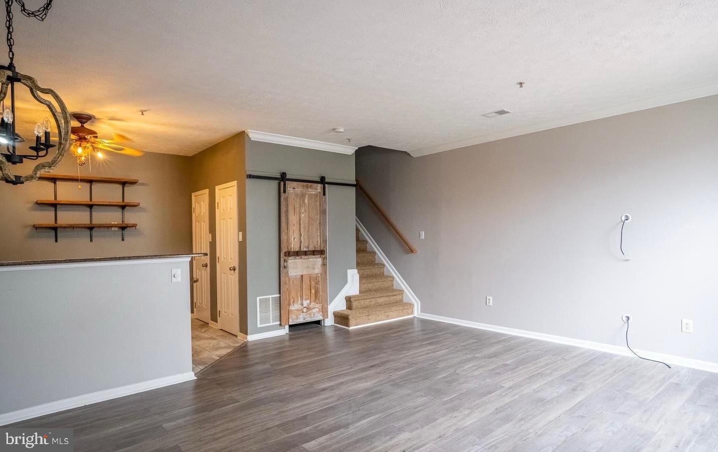 4910 Edgeware Terrace Frederick, MD 21703 - Photo 5 of 9 a view of an entryway with wooden floor