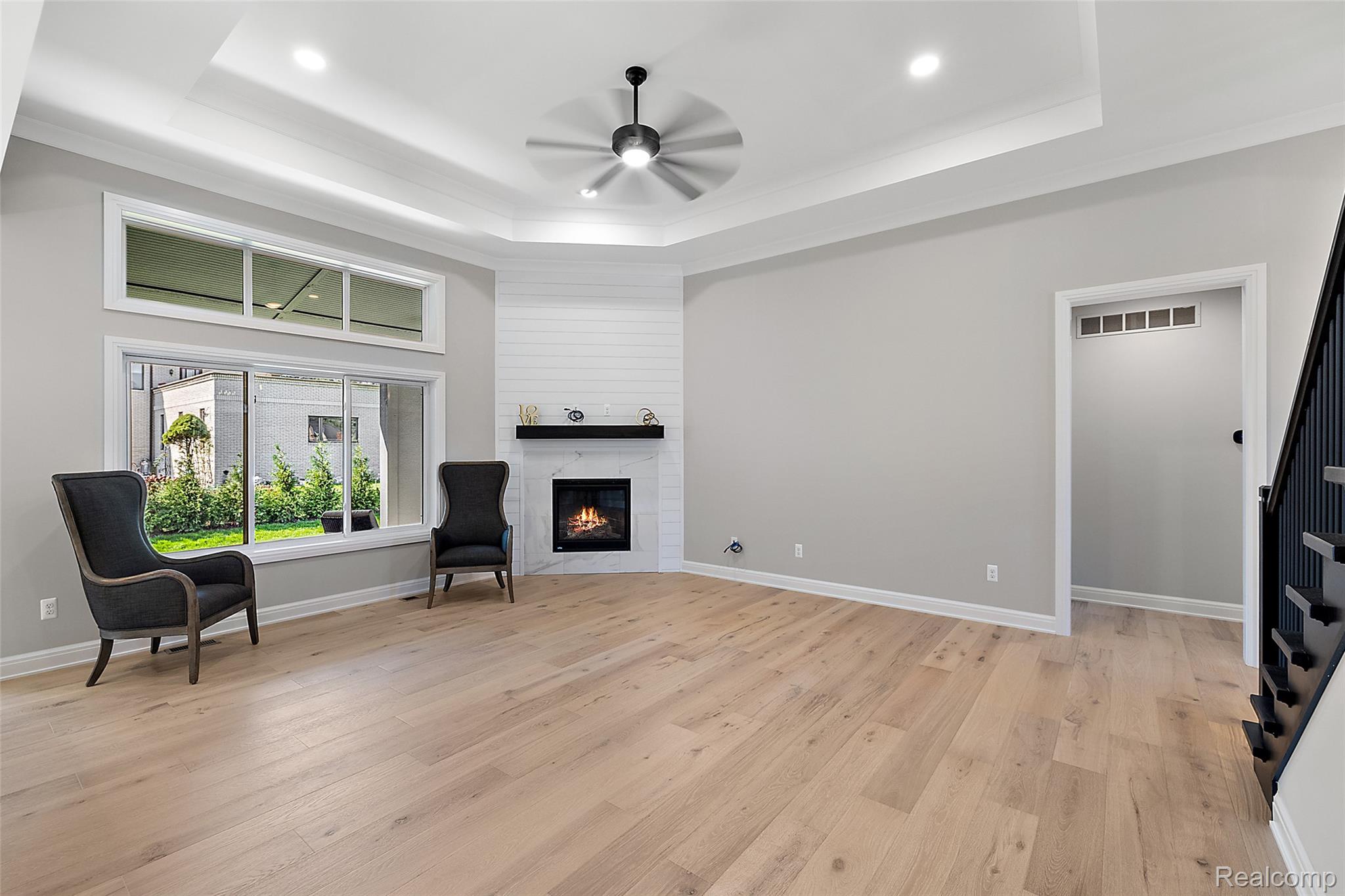 8267 Sandi Lane Romeo, MI 48065 - Photo 24 of 46 Tray ceiling with recessed lighting and a ceiling fan