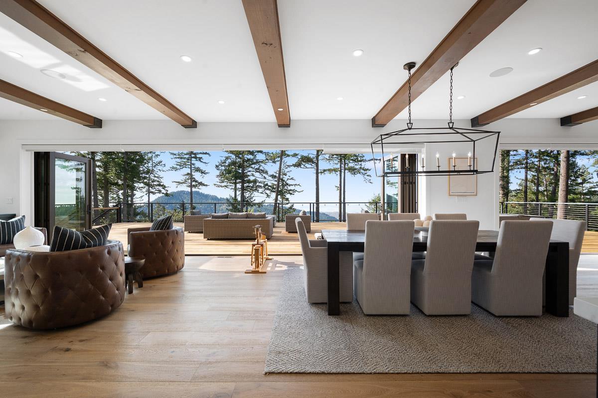 220 Ware Road Woodside, CA 94062 - Photo 12 of 59 a living room with couches and kitchen view with wooden floor