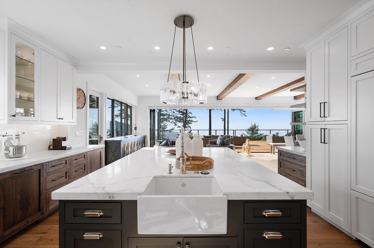 220 Ware Road Woodside, CA 94062 - Photo 17 of 59 a view of a kitchen with kitchen island a counter top space a sink stainless steel appliances and cabinets