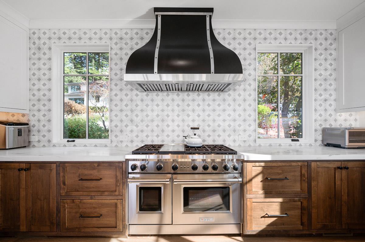 220 Ware Road Woodside, CA 94062 - Photo 18 of 59 a kitchen with granite countertop a stove a microwave a sink and cabinets