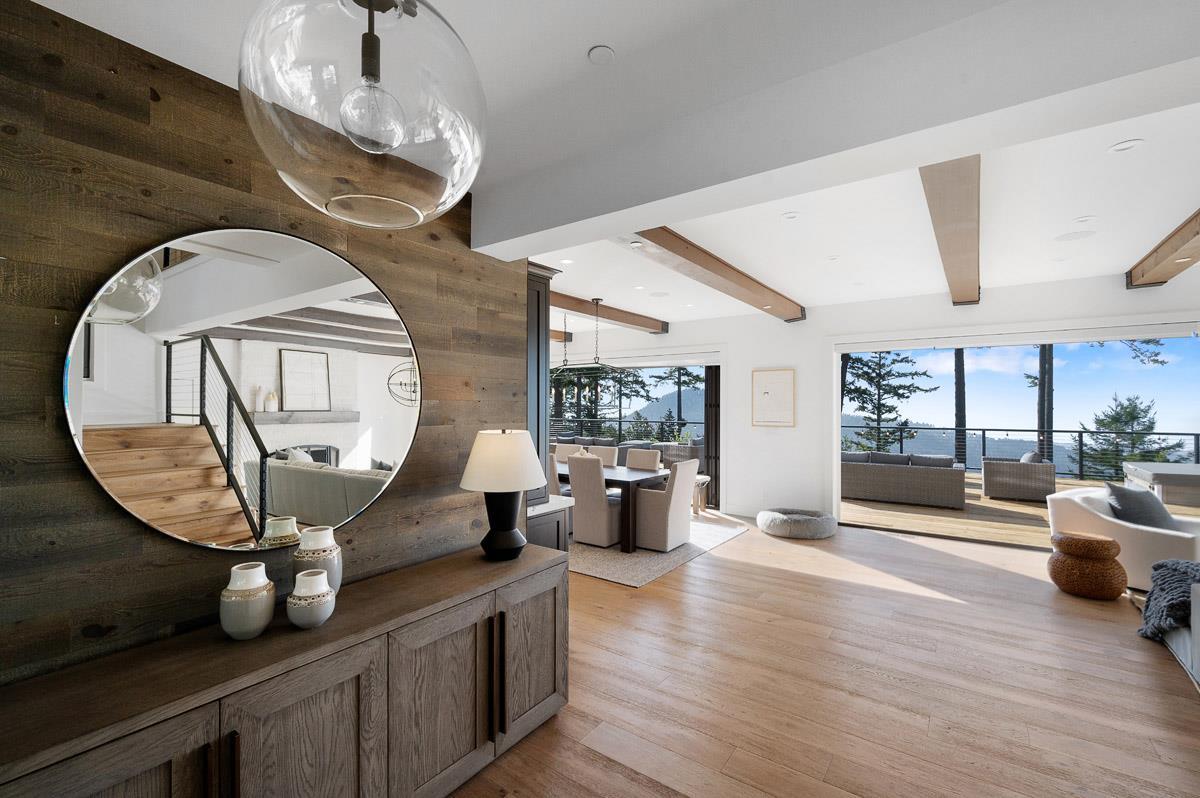 220 Ware Road Woodside, CA 94062 - Photo 2 of 59 a living room with furniture a chandelier and a fireplace
