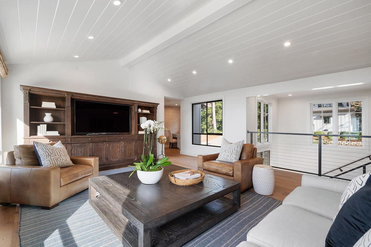 220 Ware Road Woodside, CA 94062 - Photo 22 of 59 a living room with furniture a flat screen tv and a large window