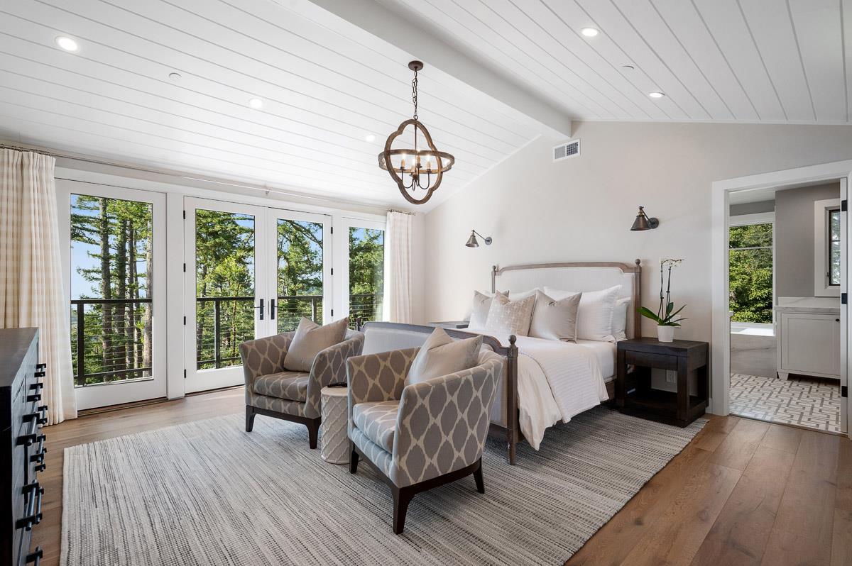 220 Ware Road Woodside, CA 94062 - Photo 23 of 59 a bed room with a bed and a large window
