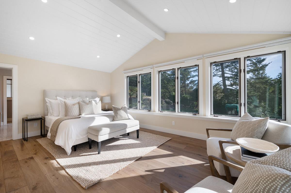 220 Ware Road Woodside, CA 94062 - Photo 27 of 59 a spacious bedroom with a bed and glass window