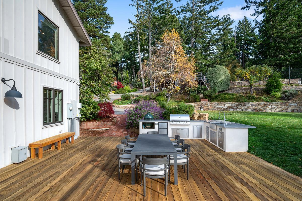 220 Ware Road Woodside, CA 94062 - Photo 38 of 59 a view of a patio with table and chairs and potted plants