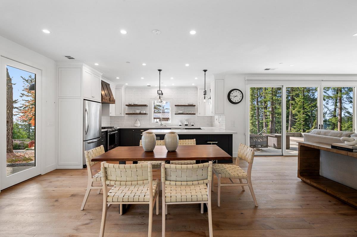 220 Ware Road Woodside, CA 94062 - Photo 44 of 59 a dining room with stainless steel appliances granite countertop furniture a large window and a kitchen view