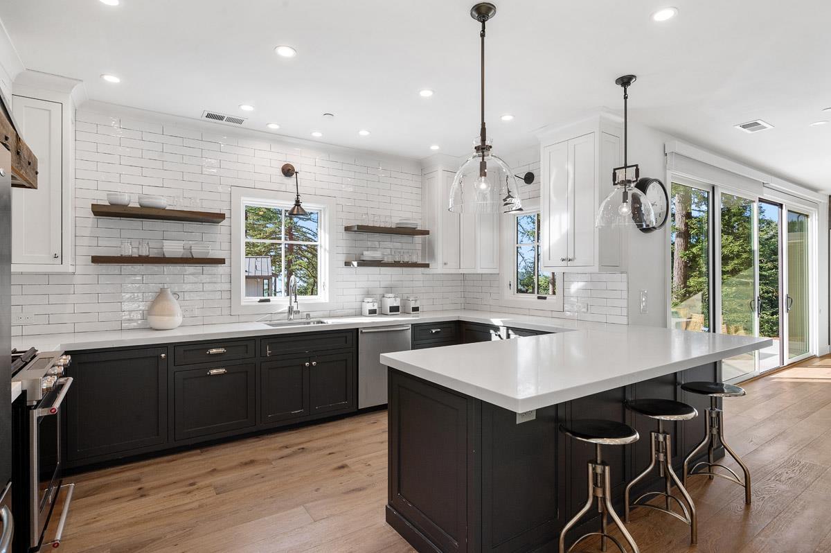 220 Ware Road Woodside, CA 94062 - Photo 48 of 59 a kitchen with a sink center island and stainless steel appliances