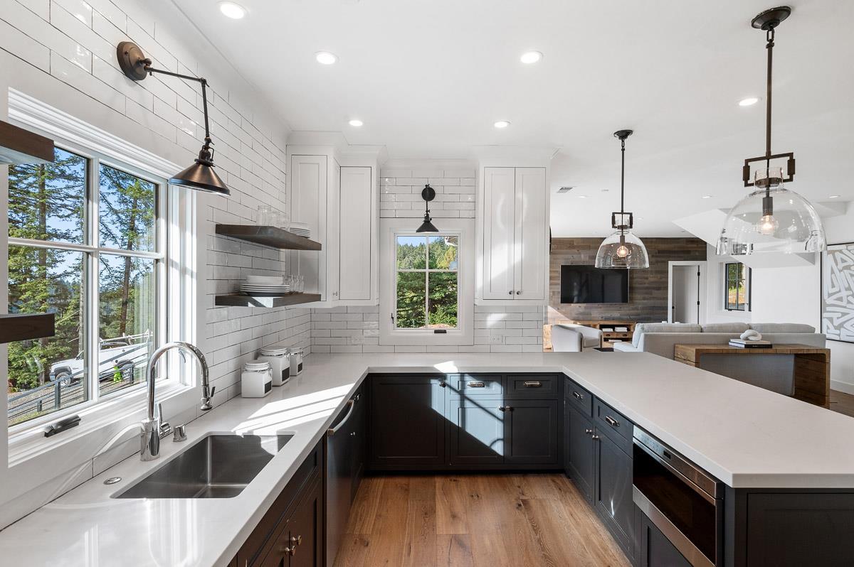220 Ware Road Woodside, CA 94062 - Photo 50 of 59 a kitchen with kitchen island granite countertop a sink appliances cabinets and a counter top space