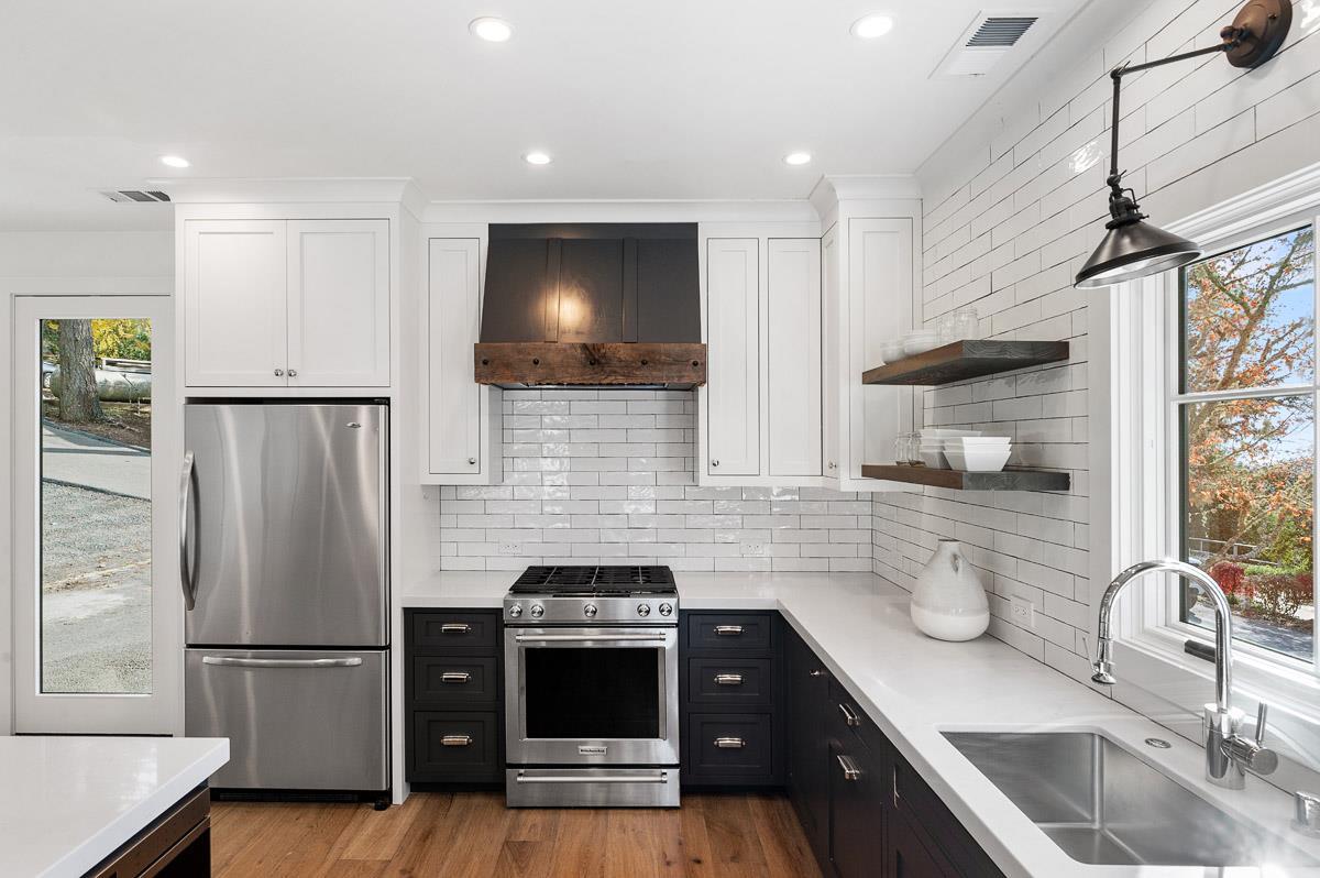 220 Ware Road Woodside, CA 94062 - Photo 51 of 59 a kitchen with a refrigerator sink and wooden floor