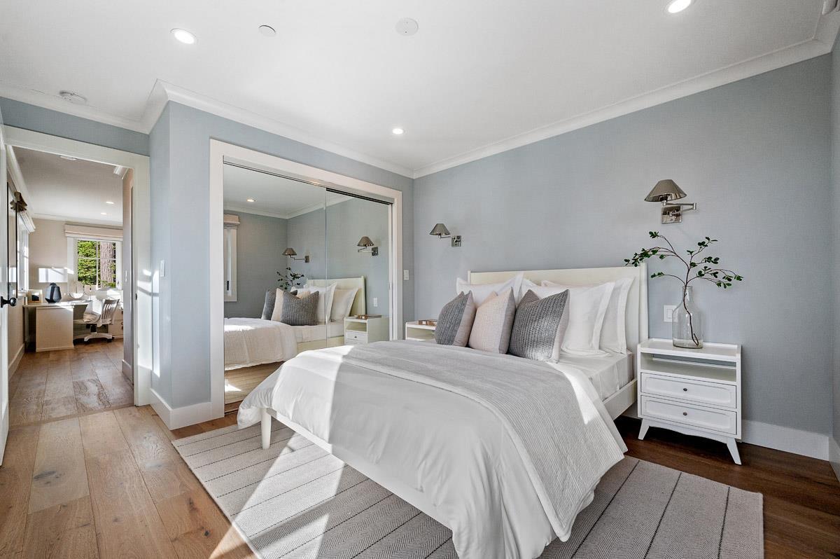 220 Ware Road Woodside, CA 94062 - Photo 53 of 59 a bedroom with a bed and a chandelier