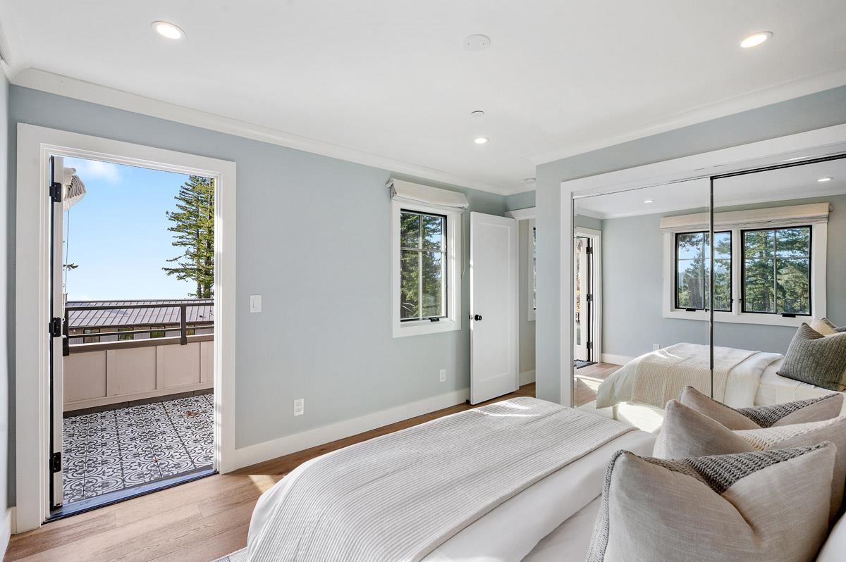 220 Ware Road Woodside, CA 94062 - Photo 54 of 59 a bedroom with a bed and glass window