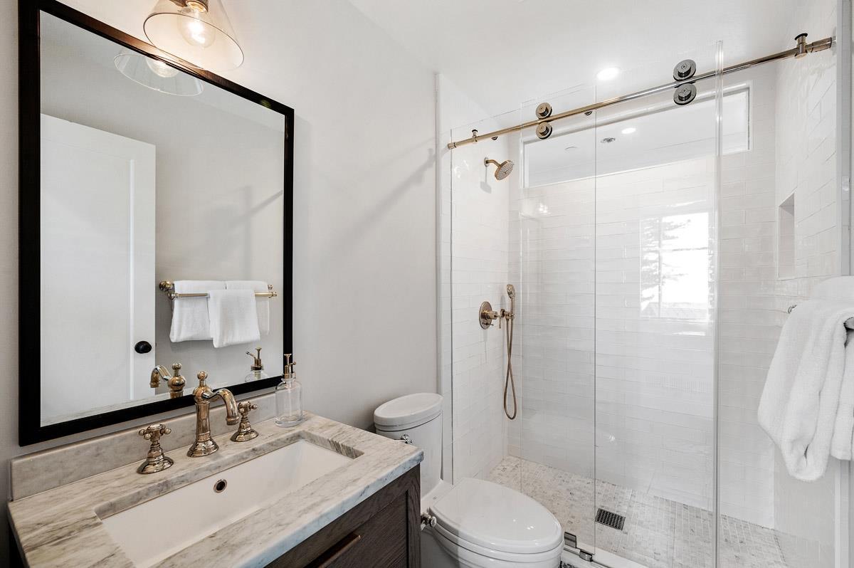 220 Ware Road Woodside, CA 94062 - Photo 55 of 59 a bathroom with a sink vanity mirror and shower