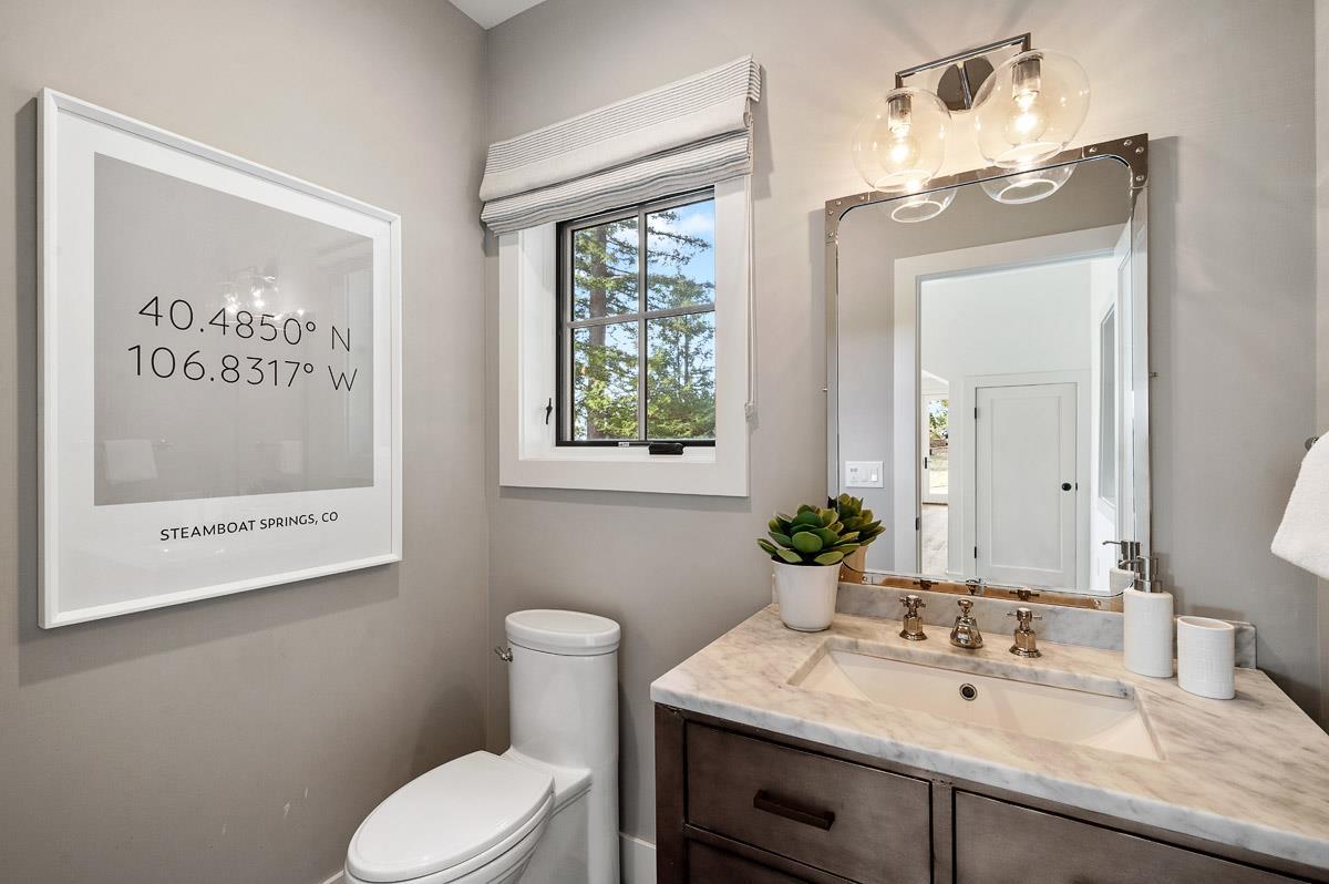 220 Ware Road Woodside, CA 94062 - Photo 56 of 59 a bathroom with a granite countertop sink mirror vanity and toilet