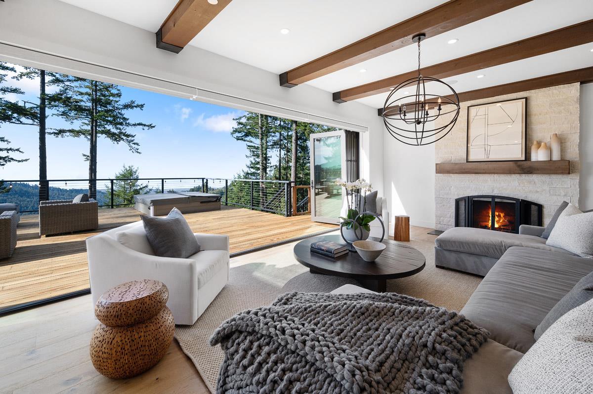 220 Ware Road Woodside, CA 94062 - Photo 6 of 59 a living room with furniture fireplace and a large window