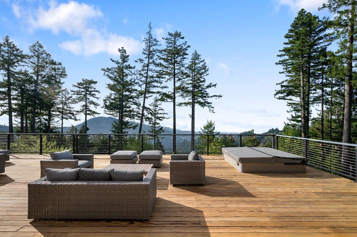 220 Ware Road Woodside, CA 94062 - Photo 7 of 59 a view of a patio with couches and a fire pit
