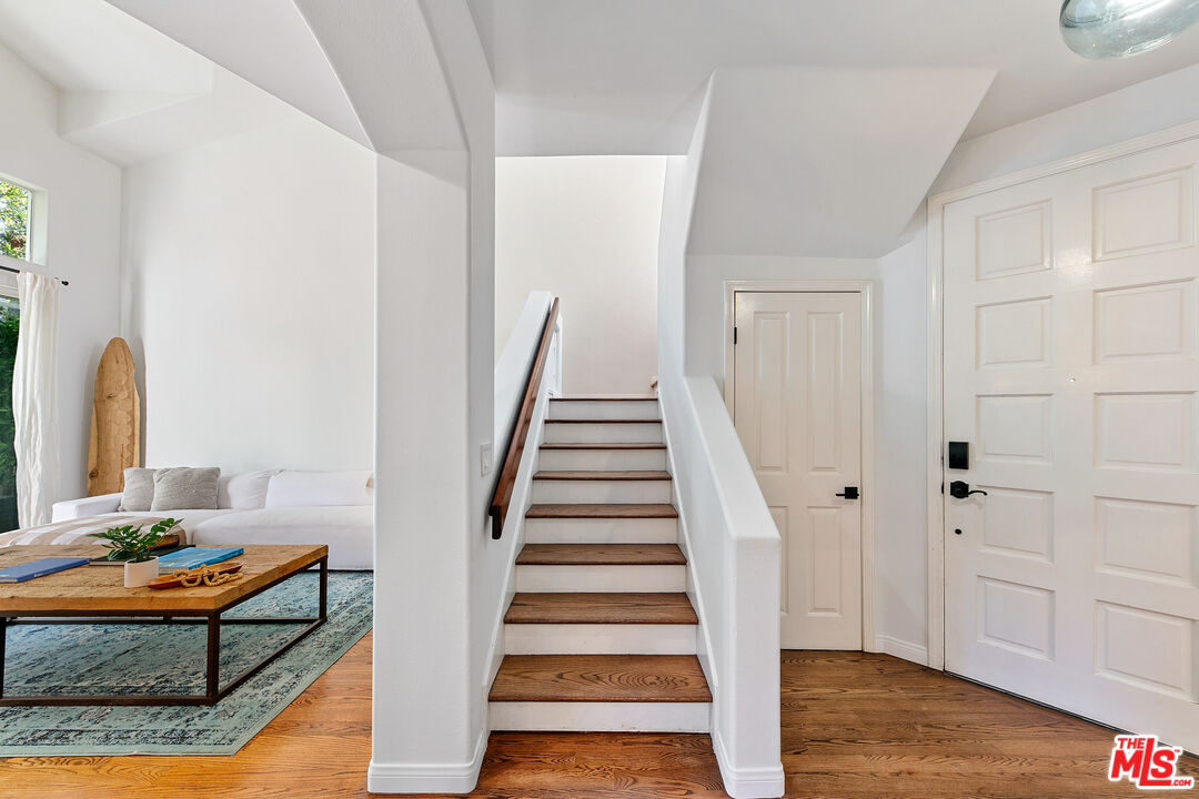 6477 Zuma View Place, Unit 125 Malibu, CA 90265 - Photo 15 of 33 a view of entryway with wooden floor and stairs