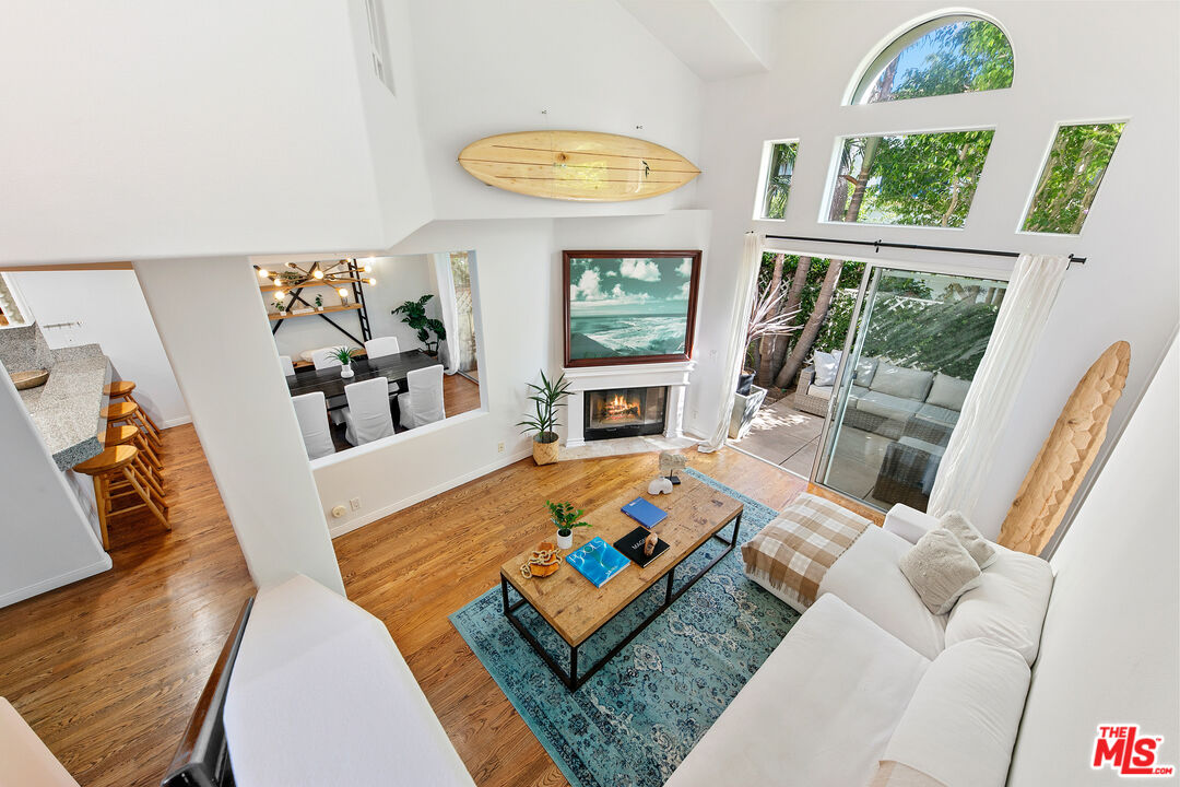 6477 Zuma View Place, Unit 125 Malibu, CA 90265 - Photo 16 of 33 a living room with furniture and a flat screen tv