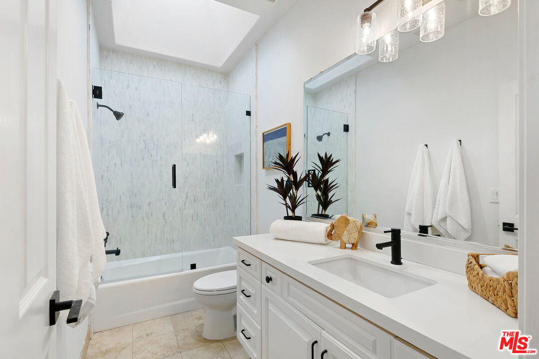 6477 Zuma View Place, Unit 125 Malibu, CA 90265 - Photo 23 of 33 a bathroom with a sink a toilet and shower