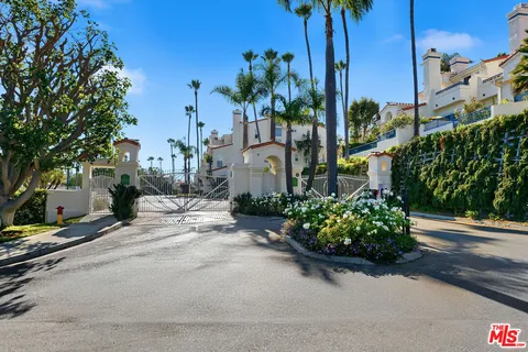 an aerial view of residential building and ocean
