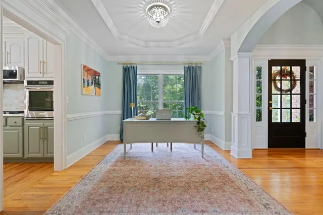 a kitchen with sink cabinets and wooden floor