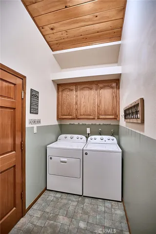 a spacious bathroom with a mirror and a sink