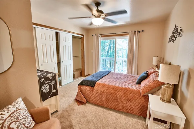 a bedroom with two beds and a chandelier
