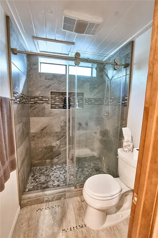 a view of deck with patio and wooden floor