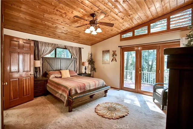 a living room with furniture ceiling fan and a window