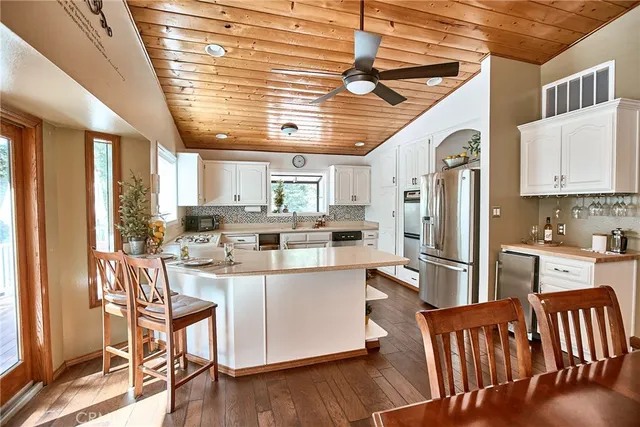a kitchen with sink cabinets and fireplace