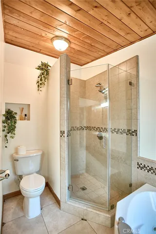 a bedroom with a bed and chair