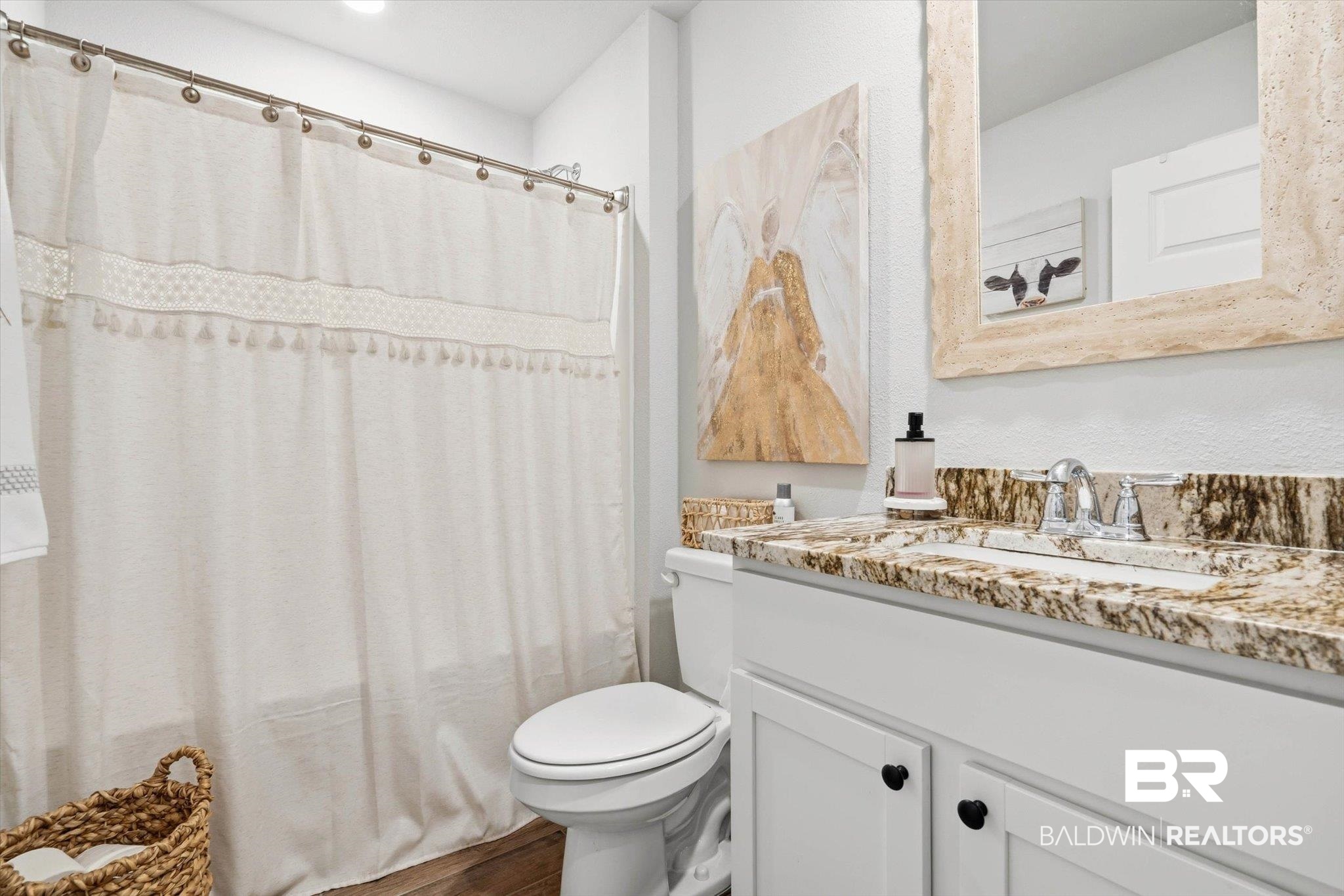 17041 Muse Street Loxley, AL 36551 - Photo 23 of 44 Full bath featuring vanity, dark wood-type flooring, and shower / bathtub combination with curtain
