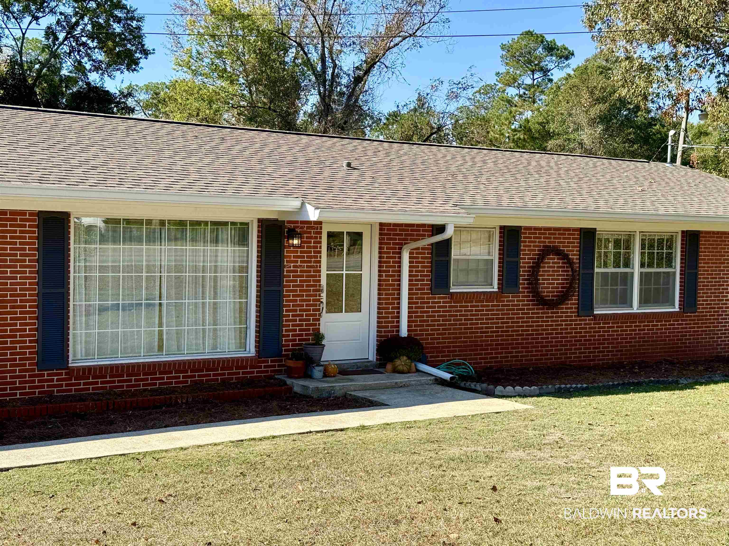 2785 Appleton Road Brewton, AL 36426 - Photo 1 of 28 Single story home featuring a front lawn, brick siding, and a shingled roof