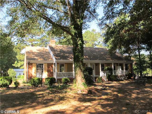 1994 Shallow Well Road Manakin-Sabot, VA 23103 - Photo 1 of 23 a front view of a house with a tree in a yard