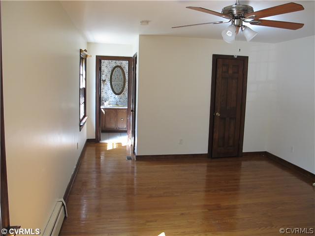 1994 Shallow Well Road Manakin-Sabot, VA 23103 - Photo 14 of 23 a view of a livingroom with wooden floor and a ceiling fan