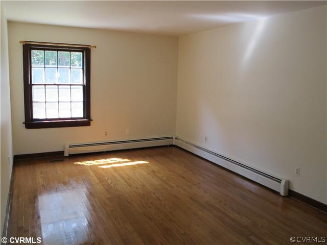 1994 Shallow Well Road Manakin-Sabot, VA 23103 - Photo 17 of 23 an empty room with wooden floor and windows