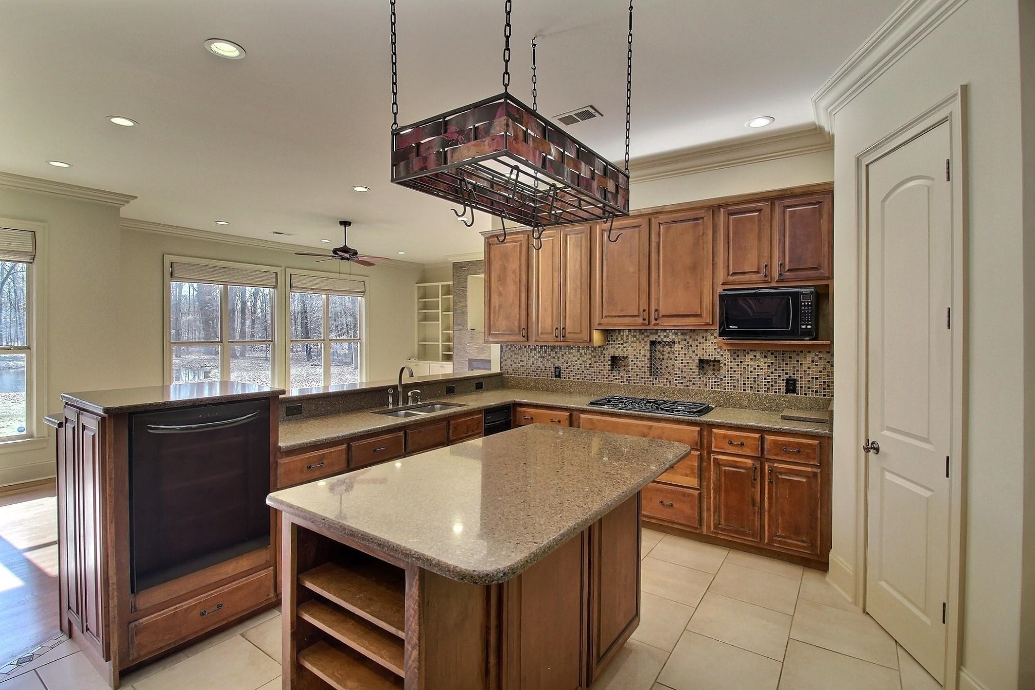 580 Hickory Lake Road Eads, TN 38028 - Photo 14 of 40 a kitchen with a stove a sink and cabinets