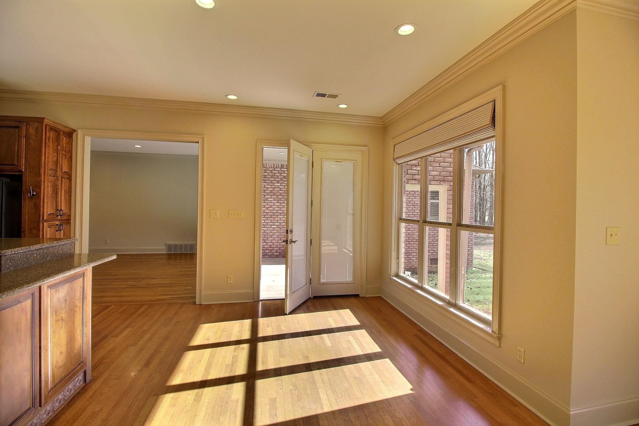 580 Hickory Lake Road Eads, TN 38028 - Photo 18 of 40 a view of a room with wooden floor and windows