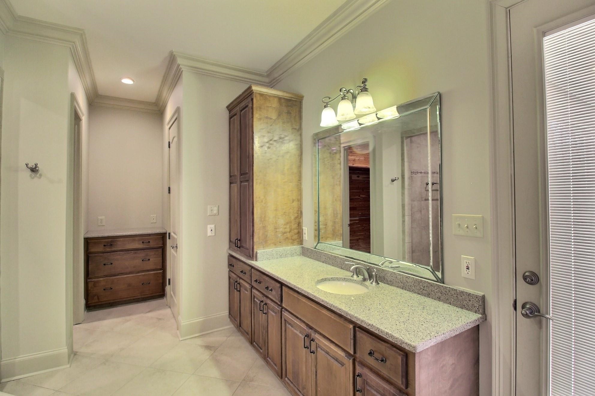580 Hickory Lake Road Eads, TN 38028 - Photo 26 of 40 a bathroom with a double vanity sink and a mirror