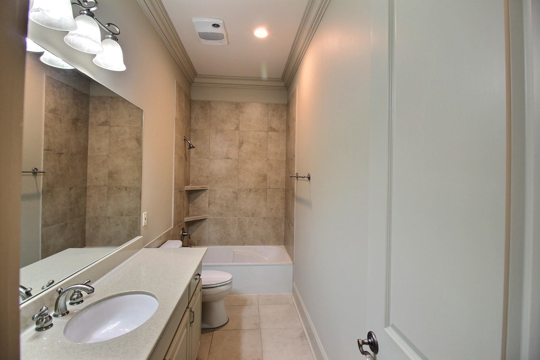 580 Hickory Lake Road Eads, TN 38028 - Photo 34 of 40 a bathroom with a sink a toilet and shower