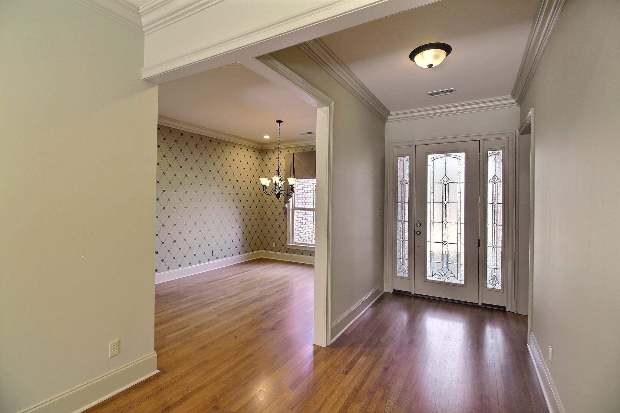 580 Hickory Lake Road Eads, TN 38028 - Photo 10 of 40 an empty room with wooden floor and windows