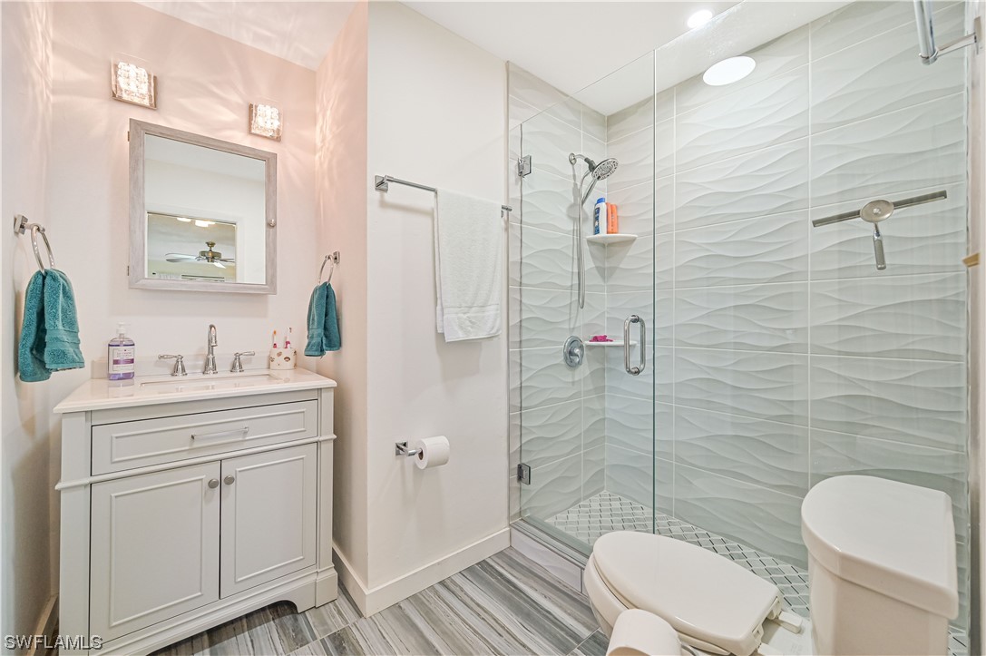 8162 Country Road, Unit 204 Fort Myers, FL 33919 - Photo 5 of 20 a bathroom with a sink a toilet and shower
