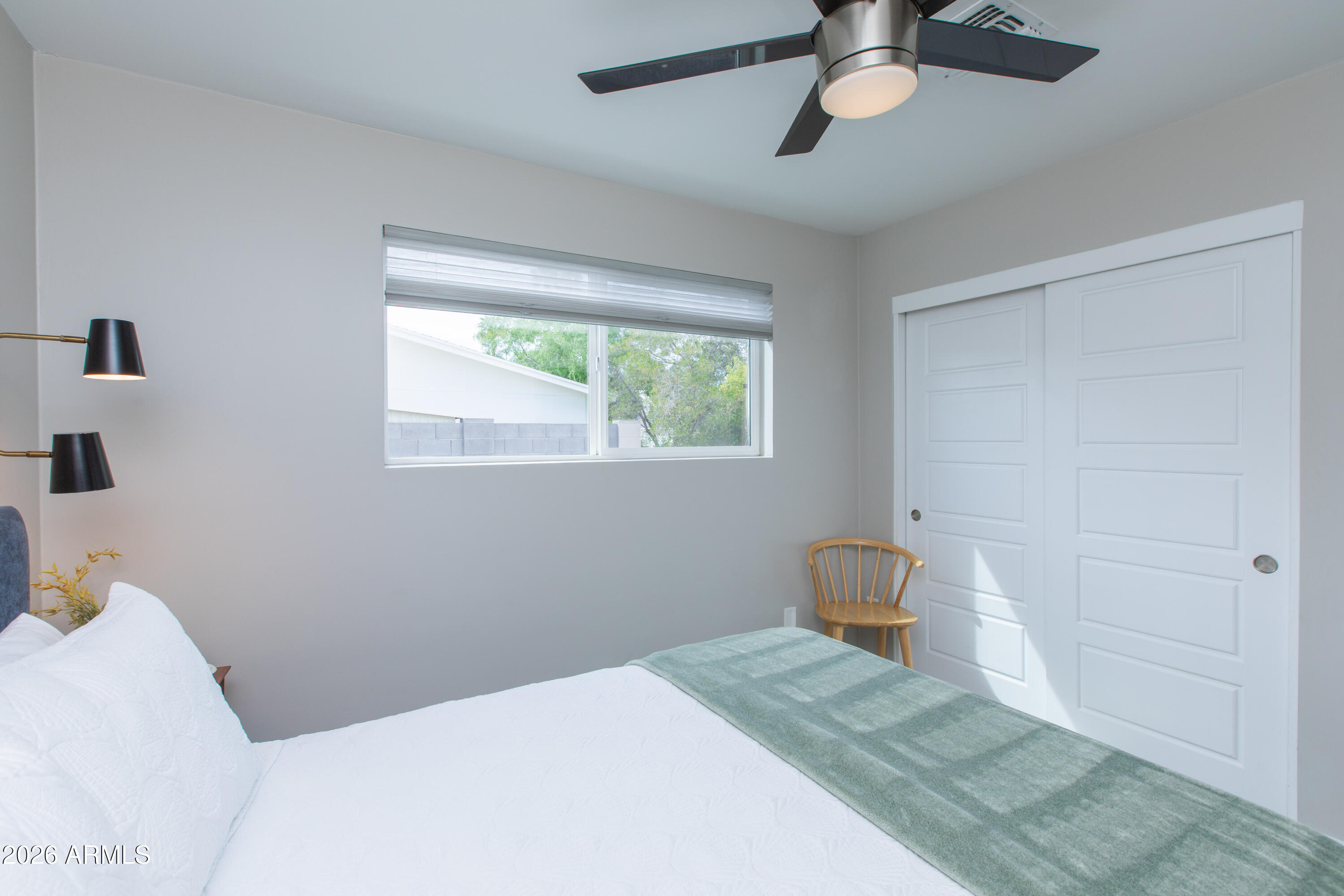5541 East Cheery Lynn Road Phoenix, AZ 85018 - Photo 40 of 69 a bedroom with a bed and a window