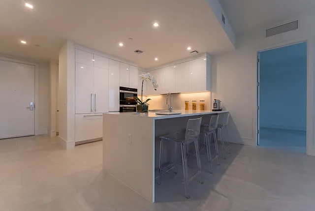 a bedroom with a bed and a night stand