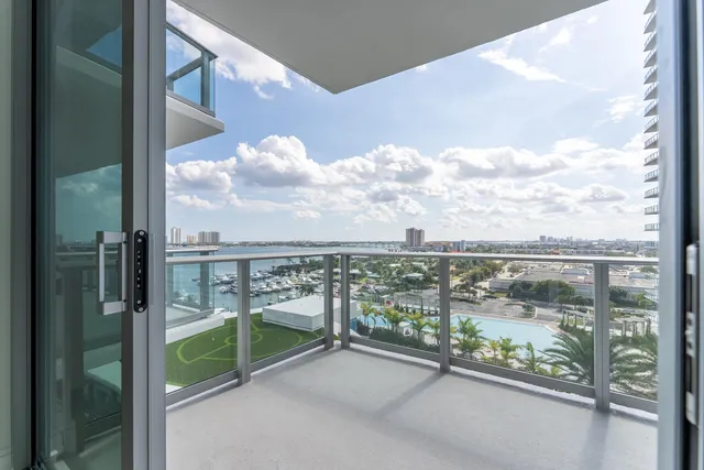 a living room with furniture and a lamp