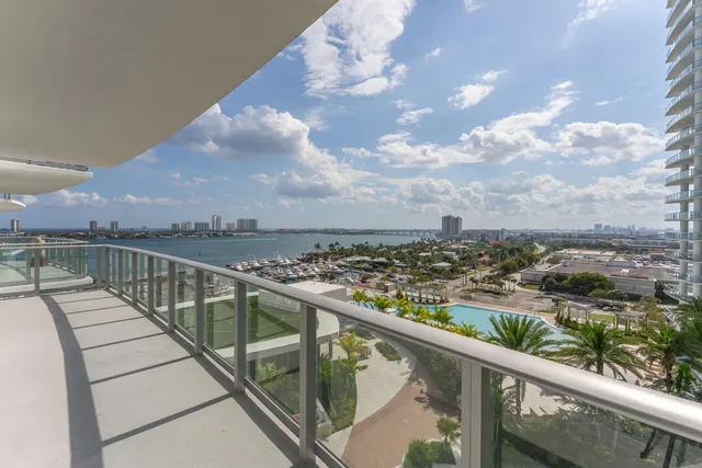 a living room with furniture and a painting on the wall